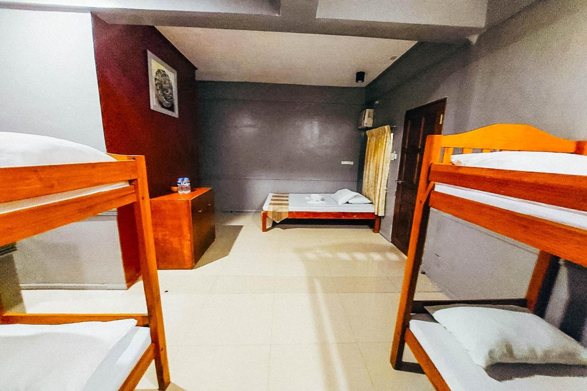 Mbg Travellers Inn Powered By Cocotel Puerto Princesa Стая снимка