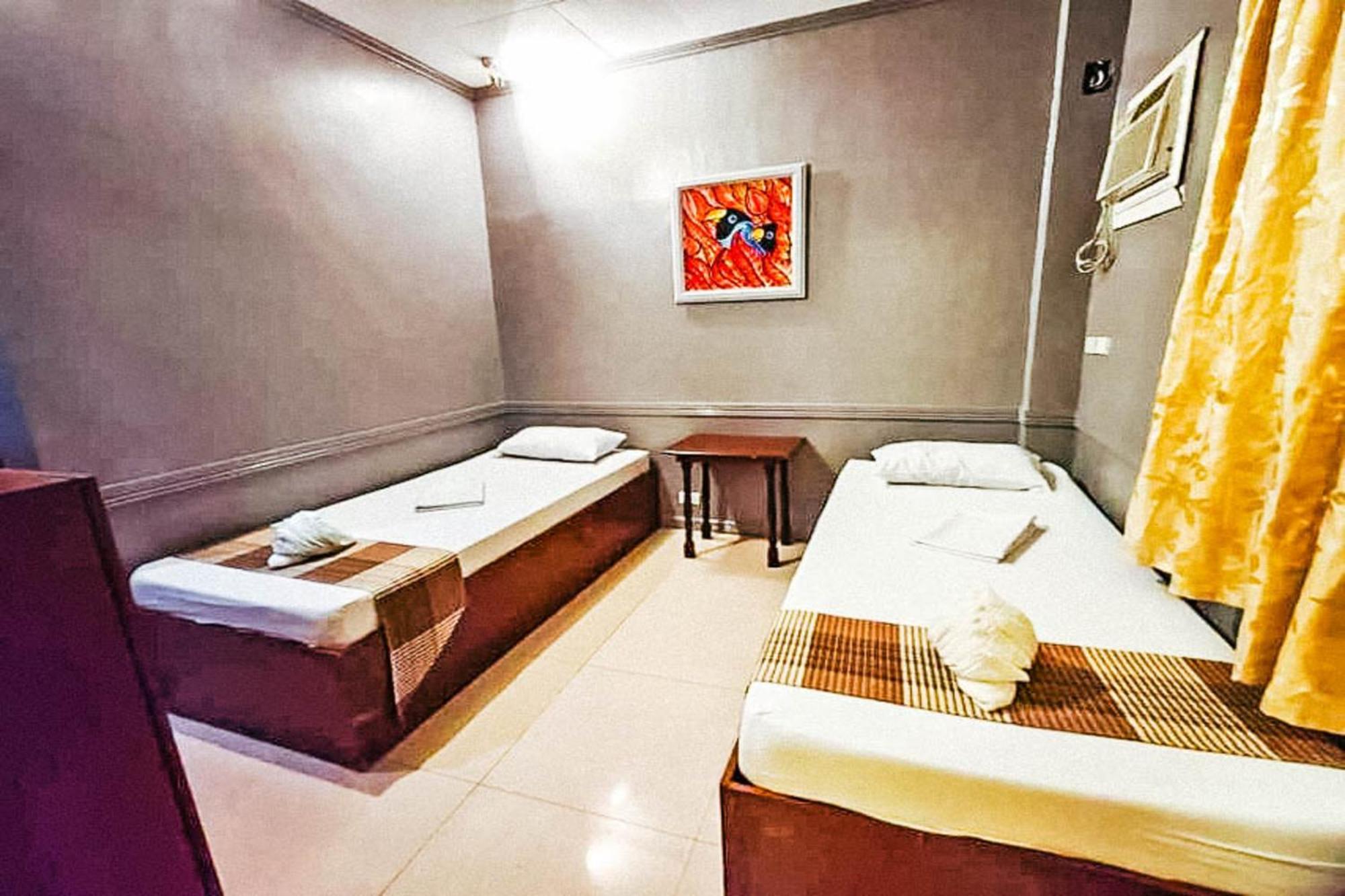 Mbg Travellers Inn Powered By Cocotel Puerto Princesa Стая снимка