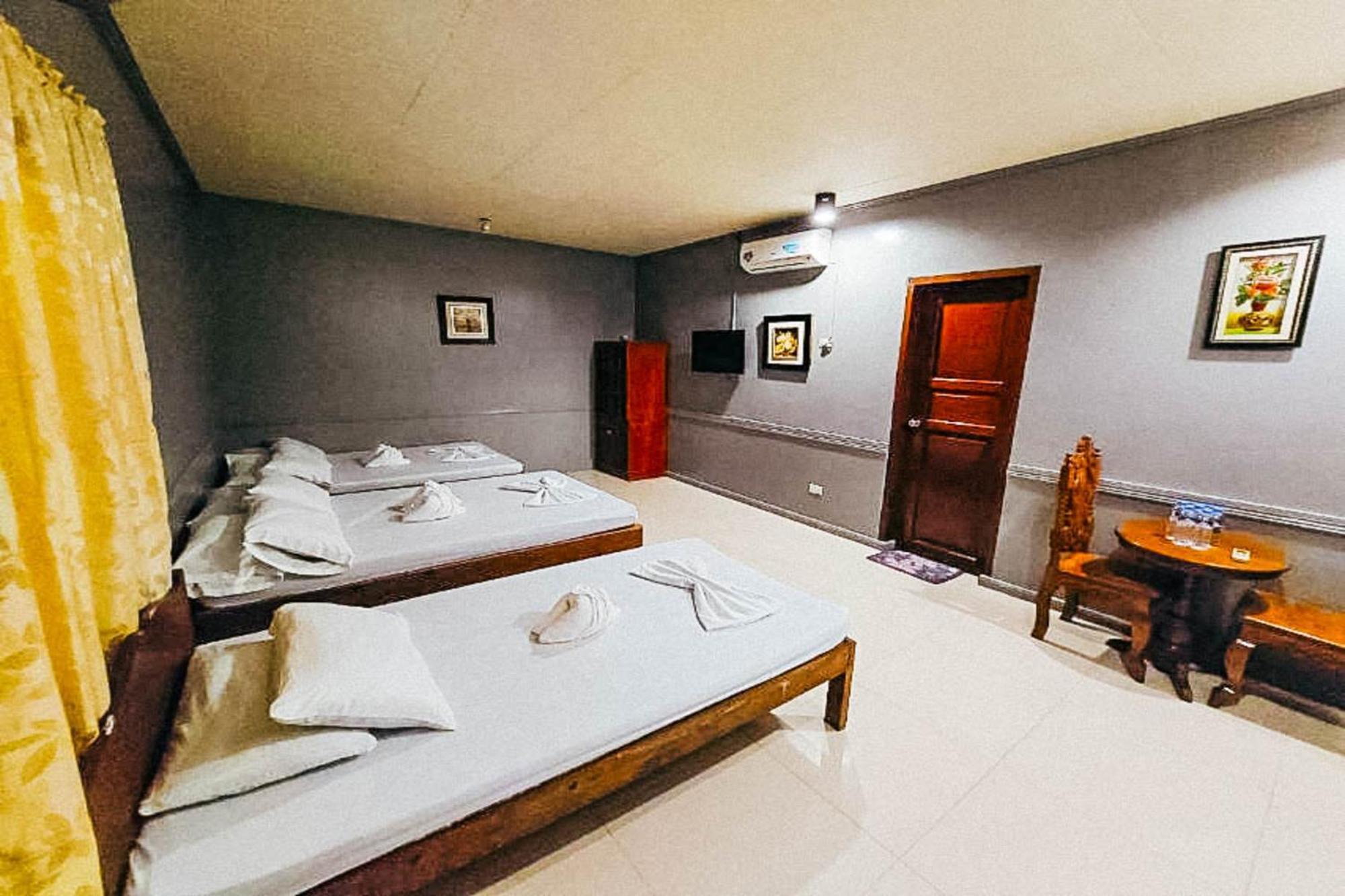 Mbg Travellers Inn Powered By Cocotel Puerto Princesa Стая снимка