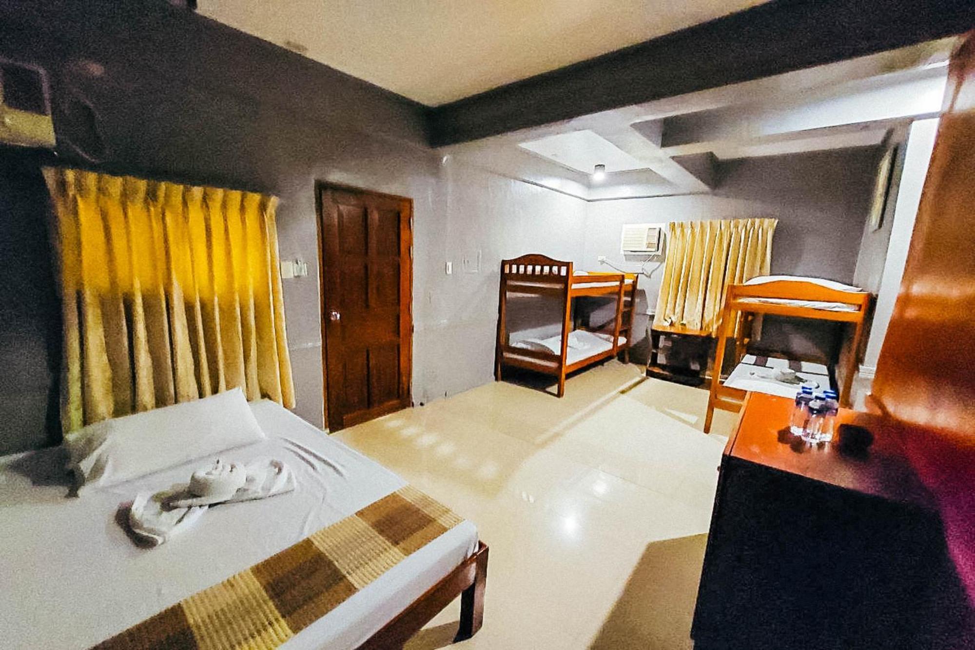 Mbg Travellers Inn Powered By Cocotel Puerto Princesa Стая снимка