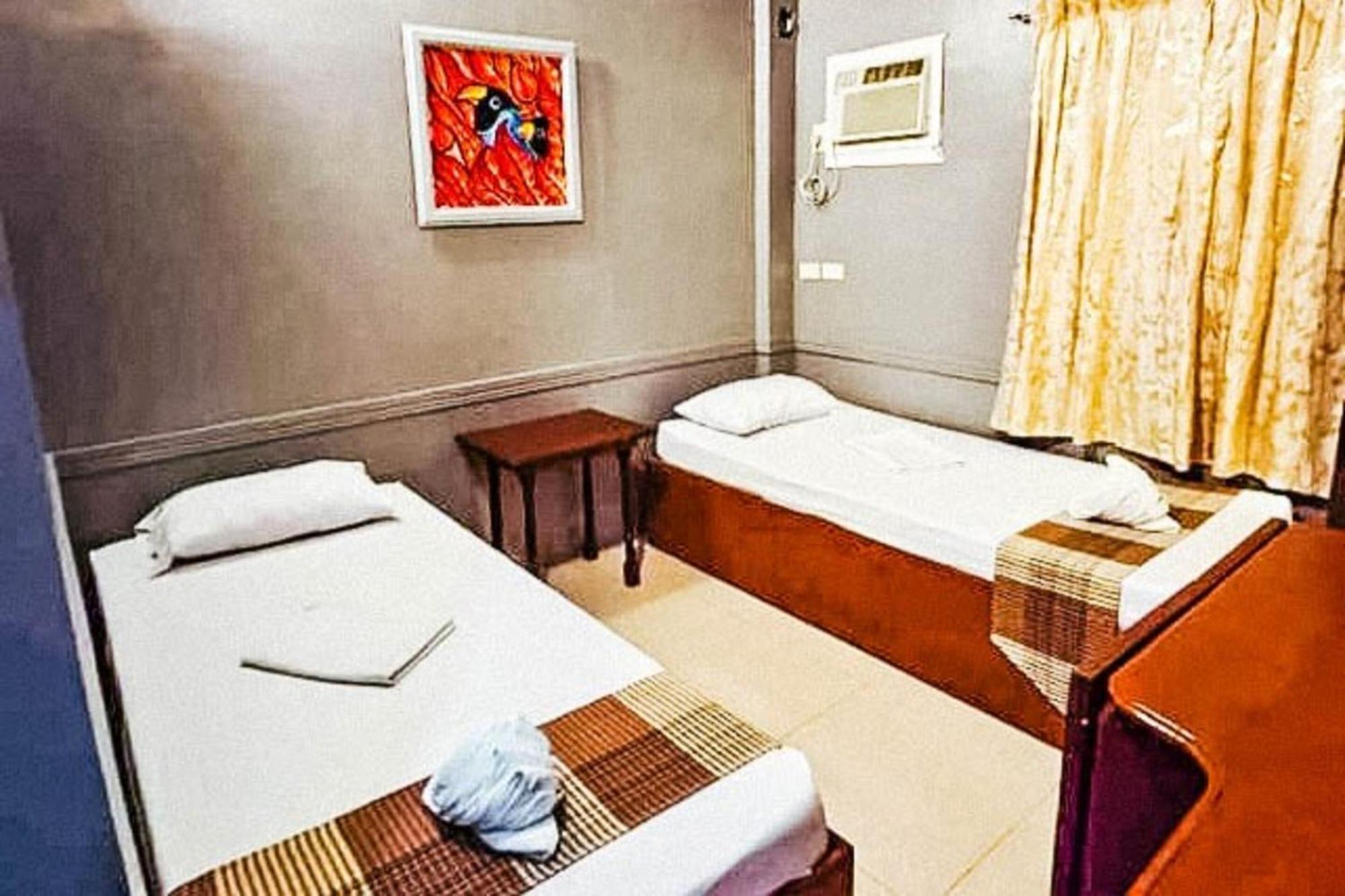 Mbg Travellers Inn Powered By Cocotel Puerto Princesa Стая снимка
