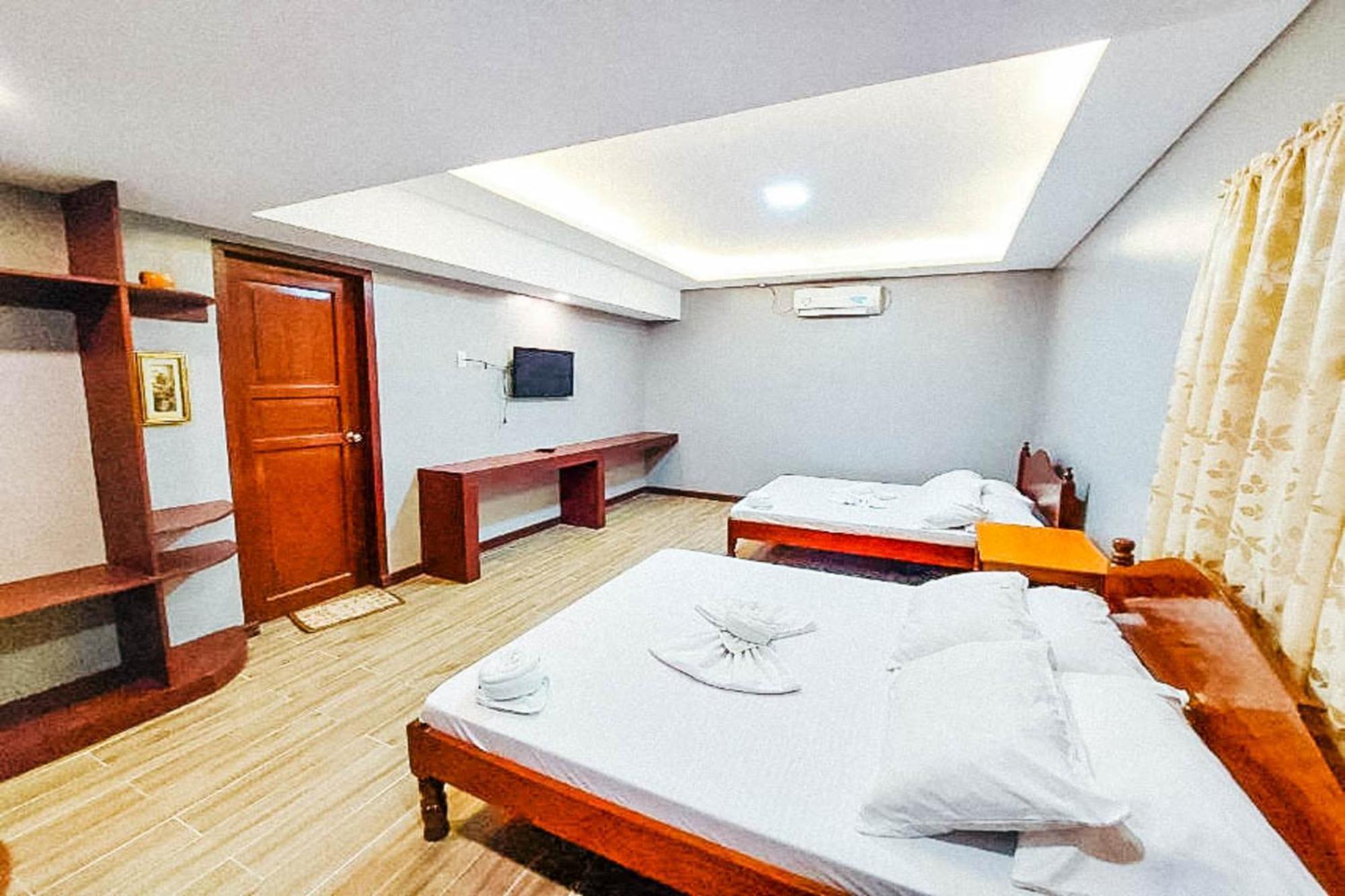 Mbg Travellers Inn Powered By Cocotel Puerto Princesa Стая снимка