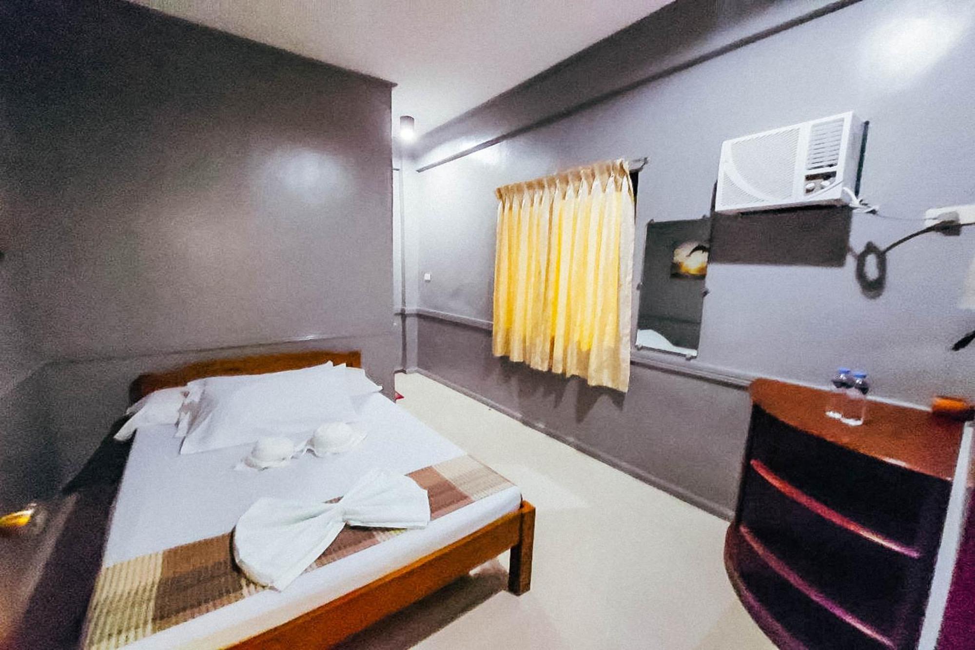 Mbg Travellers Inn Powered By Cocotel Puerto Princesa Стая снимка
