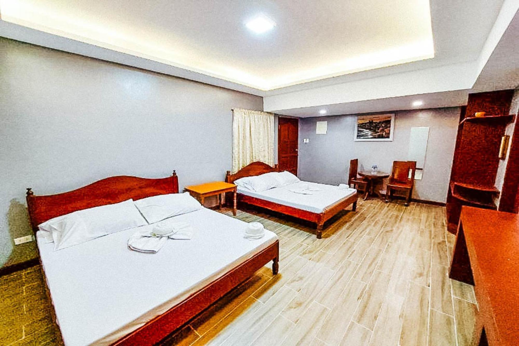 Mbg Travellers Inn Powered By Cocotel Puerto Princesa Стая снимка