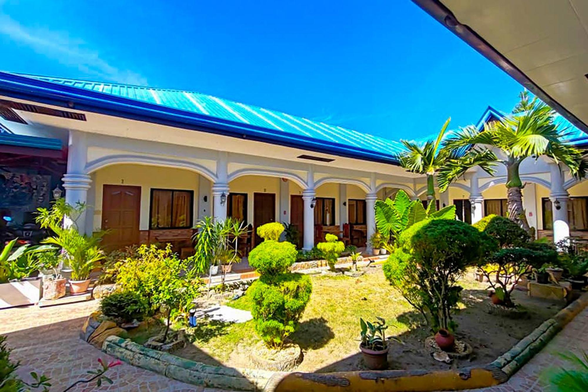 Mbg Travellers Inn Powered By Cocotel Puerto Princesa Екстериор снимка